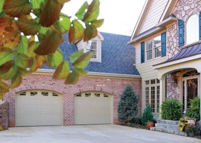 residential house with a cream colored garage door